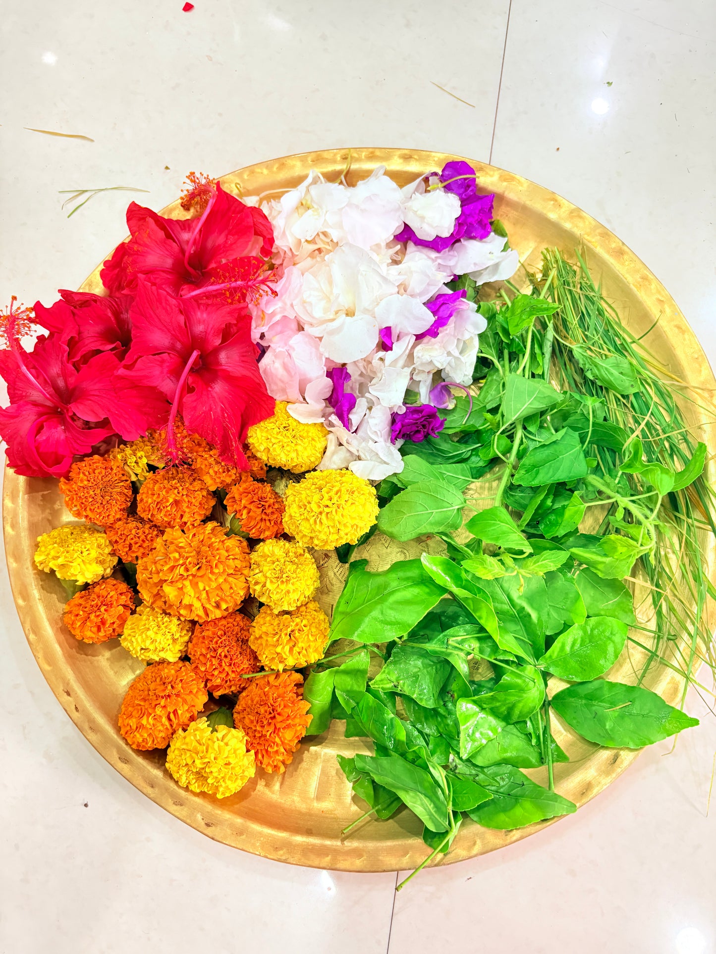 Puja Thali(Red Hibiscus, Marigolds (Yellow/Orange), White/Purple Crepe Jasmine/Oleander, Bel Leaves, Durva Grass)